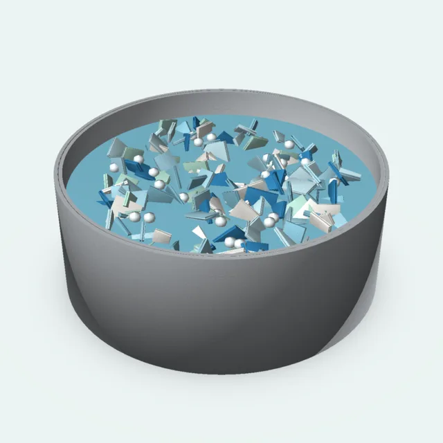 A wash tank full of plastic flakes and water